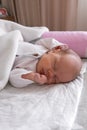 cute little newborn baby girl peacefully sleeps