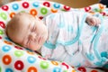 Cute little newborn baby girl sleeping wrapped in blanket Royalty Free Stock Photo