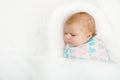 Cute little newborn baby girl sleeping wrapped in blanket Royalty Free Stock Photo