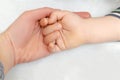 Cute little newborn infant baby child,woman hands, mother and son,sleeping lying on bed.family day Royalty Free Stock Photo