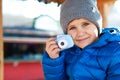Cute little photographer with toy camera Royalty Free Stock Photo