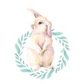 Cute little pink rabbit. Sits on the hind legs in a round frame of green leaves. Hare isolated