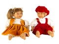 Cute little plastic baby dolls with blue eyes sitting on empty background Royalty Free Stock Photo