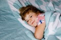 Cute little preschool girl sleeping in bed. Adorable baby child dreaming, healthy sleep of children by day. Deep Royalty Free Stock Photo