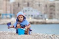 Cute little preschooler boy, playing in the sand on the beach with beach toys Royalty Free Stock Photo