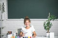 Cute little preschooler child girl drawing at school. Child girl painting on elementary school. Kids creative education Royalty Free Stock Photo