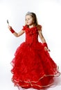 Cute little princess dressed in red isolated on white background