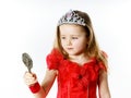 Cute little princess dressed in red isolated on white background