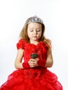 Cute little princess dressed in red isolated on white background