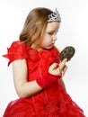 Cute little princess dressed in red isolated on white background