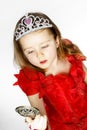 Cute little princess dressed in red isolated on white background