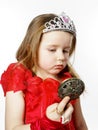 Cute little princess dressed in red isolated on white background