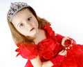 Cute little princess dressed in red isolated on white background