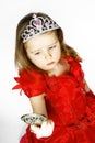 Cute little princess dressed in red isolated on white background