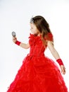 Cute little princess dressed in red on white background