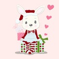 Cute little rabbit cartoon wear dress santa claus and gift box.