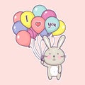 Cute little rabbit holding air balloons with the inscription I love you Royalty Free Stock Photo