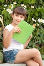 Cute Little School Girl Reading Book