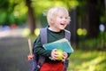 Cute little schoolboy with his backpack and apple. Back to school concept. Royalty Free Stock Photo