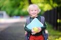 Cute little schoolboy with his backpack and apple. Back to school concept. Royalty Free Stock Photo