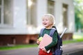 Cute little schoolboy with his backpack and apple. Back to school concept. Royalty Free Stock Photo