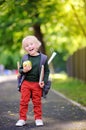 Cute little schoolboy with his backpack and apple. Back to school concept. Royalty Free Stock Photo