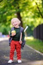 Cute little schoolboy outdoors on sunny autumn day. Back to school concept. Royalty Free Stock Photo
