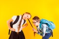 The cute little schoolboy pulls the schoolgirl's braid Royalty Free Stock Photo