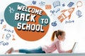 cute little schoolgirl reading book and lying on windowsill with icons and welcome back to Royalty Free Stock Photo