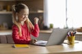 Cute Little Schoolgirl Using Laptop And Celebrating Success At Home Royalty Free Stock Photo