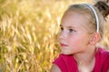 Cute little serious girl looking for someone or Royalty Free Stock Photo