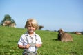 Cute little smiling bavarian boy on a country field during Oktoberfest in Germany Royalty Free Stock Photo