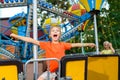 Cute little smiling boy riding a Carnival Carousel Royalty Free Stock Photo