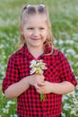 Cute little smiling girl in the chamomile field Royalty Free Stock Photo