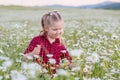 Cute little smiling girl in the chamomile field Royalty Free Stock Photo