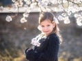 Cute little smiling girl in the chamomile field in spring Royalty Free Stock Photo