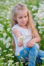 Cute little smiling girl in the chamomile field Royalty Free Stock Photo