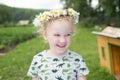 Cute little smiling girl in the chamomile wreath Royalty Free Stock Photo