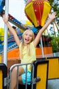 Cute little smiling girl riding a Carnival Royalty Free Stock Photo