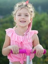 Cute little smiling happy girl close up face. Lifestyle closeup portrait of funny kids face outdoors. Summer kid outdoor Royalty Free Stock Photo