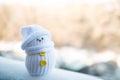 Cute little snowman on a blurry background