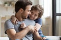 Cute little son hugging happy father, enjoying tender moment Royalty Free Stock Photo
