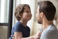 Cute little son looking at father, enjoying tender moment Royalty Free Stock Photo