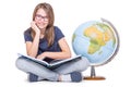 Cute little student girl with globe and book. Girl witrh glasses and teeth braces. School Education Concept Royalty Free Stock Photo