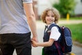 Cute little student goes to school.