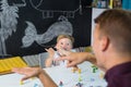 Cute little toddler boy at speechtherapist session.