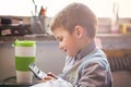 Cute little baby boy using a calculator Royalty Free Stock Photo