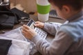 Cute little baby boy using a calculator Royalty Free Stock Photo