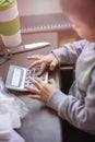 Cute little baby boy using a calculator Royalty Free Stock Photo