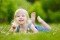 Cute little toddler girl laying in the grass Royalty Free Stock Photo